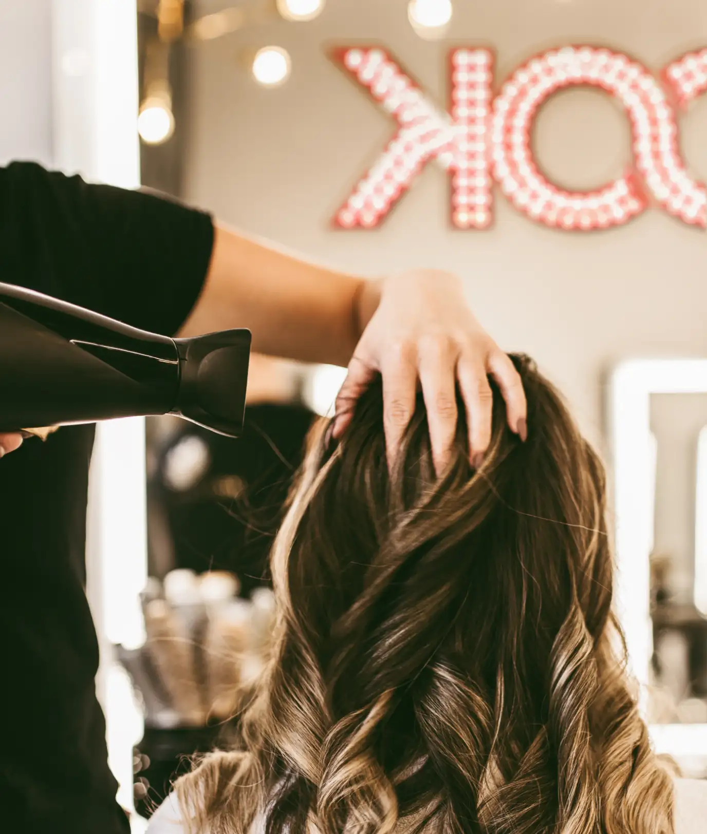Close-up detail of blow drying hair in the salon.